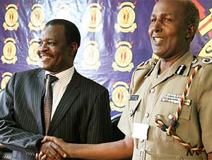 Outgoing Kenyan police commissioner Hussein Ali shakes hands with his successor, Mathew Iteere. Photo courtesy Daily Nation.