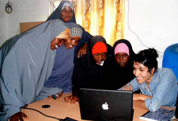 Women in the Dadaab, Kenya refugee camp receiving training to work with Samasource, a web company that outsources computer jobs to women, youth, refugees, and internally displaced people living in poverty. Photo courtesy Samasource.