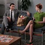 Don Draper (Jon Hamm) and Joan Holloway (Christina Hendricks) speculate on the future of their newly disabled colleague in "Guy Walks Into an Advertising Agency"--copyright AMC 2009
