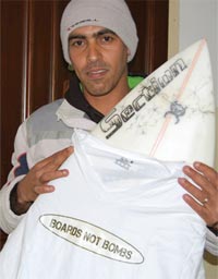 Abdallah Seri with one of the "Boards Not Bombs" T-shirts