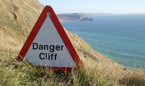 We can read the signs, but can we stop from falling off the edge? Photo by Panoramio user jk1812.