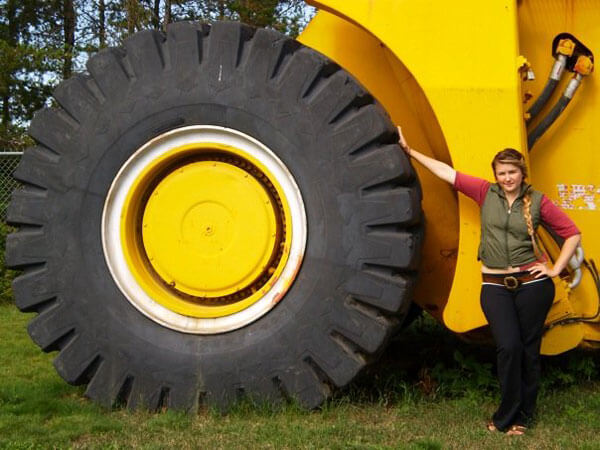 Emily Hunter with one of the huge earth-movers that's instrumental to Alberta Tar Sands development. Watch her documentary tonight on MTV.