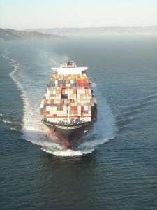A container ship carrying cargo. Slowing the pace of shipping can save money and carbon