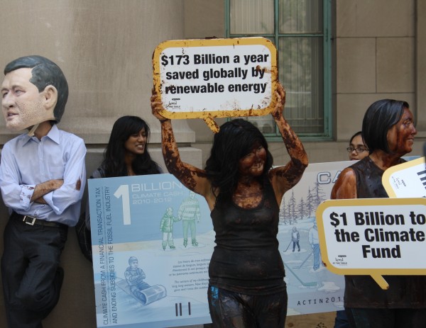 Protesters gather outside Union Station dressed as an oil spill in demonstration against Harper's environmental policy, June 17, 2010. Photo credit: Jesse Mintz