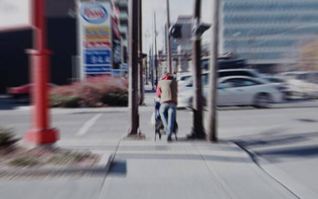 Man pushing shopping cart in Calgary. Creative Commons photo by Flickr User C Law. Man pushing shopping cart in Calgary. Creative Commons photo by Flickr User C Law.