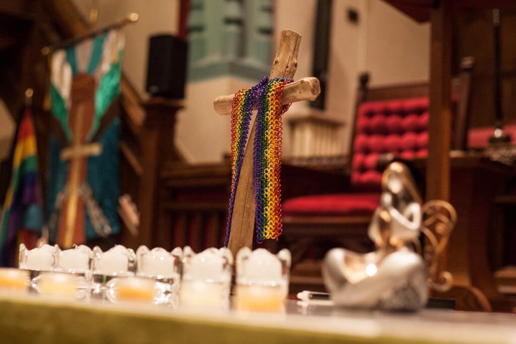 Rainbow chainmail draped over a cross during a community vigil for victims of alleged serial killer Bruce McAurthur. February 4th, 2018