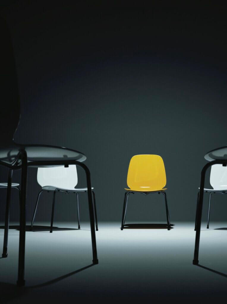 Some chairs sit dejectedly in an empty room